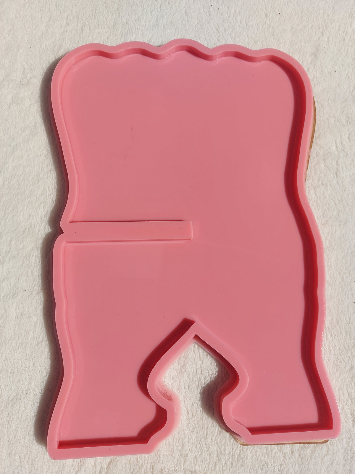 A silicone mold in the shape of a Quran stand designed for casting resin, wax, or pottery. The design features wavy, irregular outer edges, giving the finished piece a modern and attractive look when cast with resin. Available in two different sizes