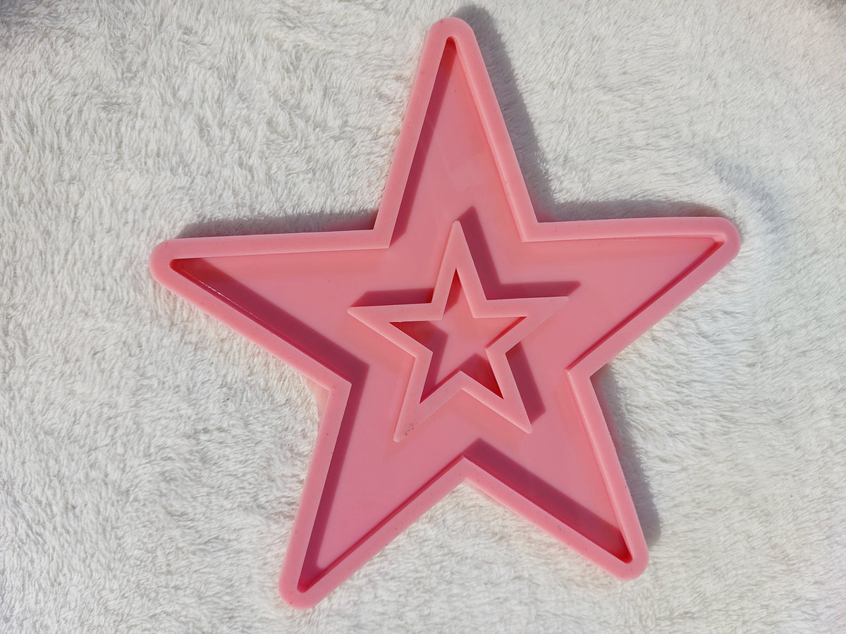 A silicone mold designed in the shape of a classic five-pointed star. Ideal for casting resin, wax, or ceramics; perfect for making coasters or wall decorations size 20 cm