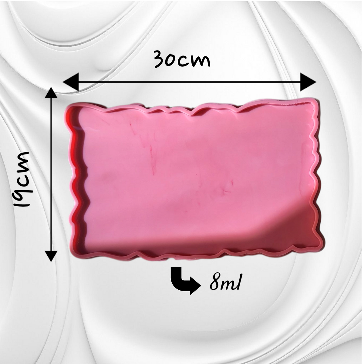 This silicone mold features a rectangular shape with irregular, serrated edges, giving the cast piece a natural appearance resembling gemstones or raw marble. It is suitable for resin, wax, or ceramics. Dimensions: 30 x 19 cm, Depth: 8 mm