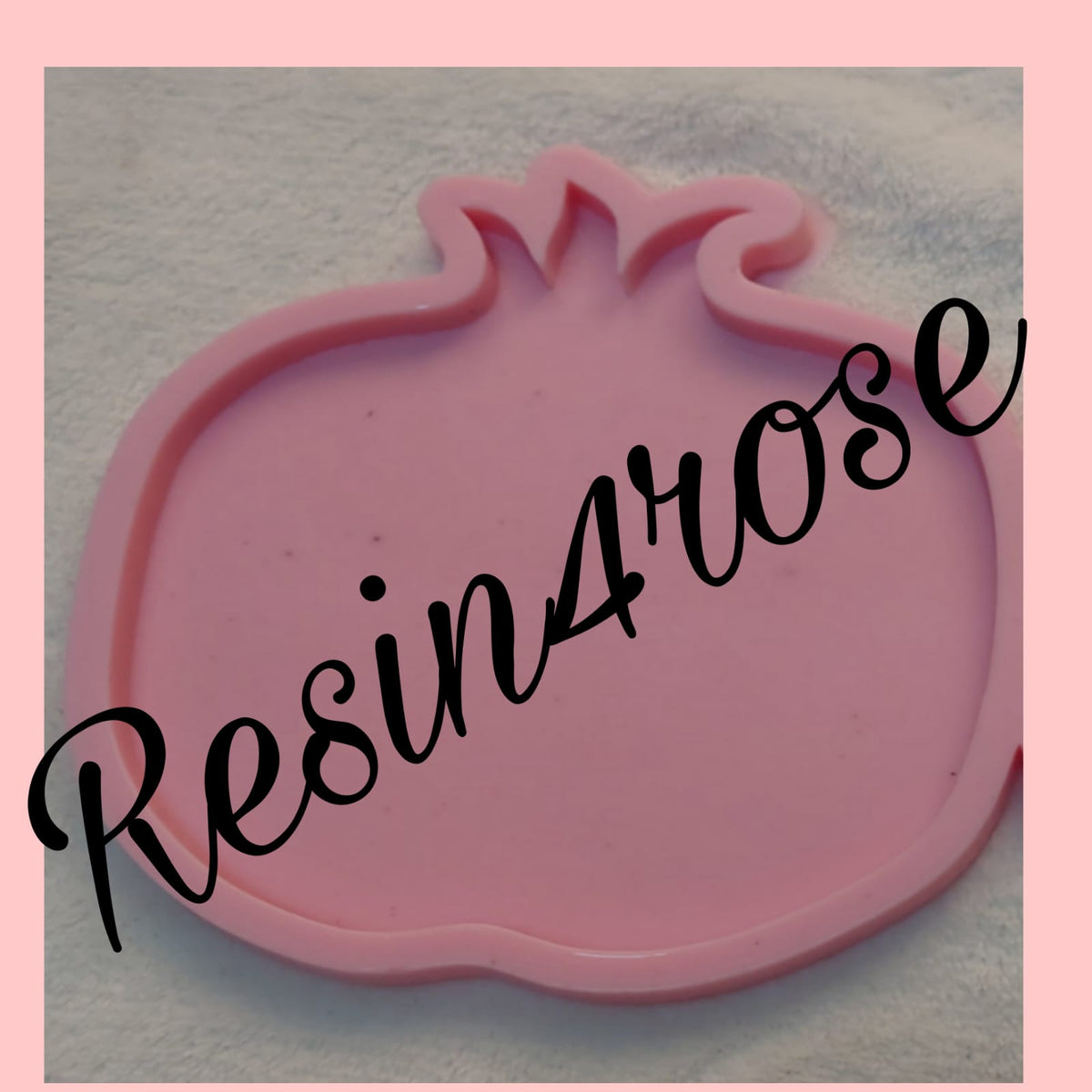 A pomegranate-shaped silicone mold designed for casting materials such as resin, wax, or plaster to create coasters or decorative pieces. Dimensions: 32 x 35 cm