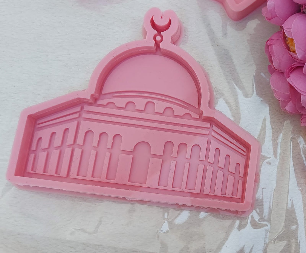 A silicone mold designed in the shape of the Dome of the Rock mosque, suitable for casting resin, wax, or ceramic. The design features intricate details of the arches and vertical lines that represent the octagonal facade of the mosque
