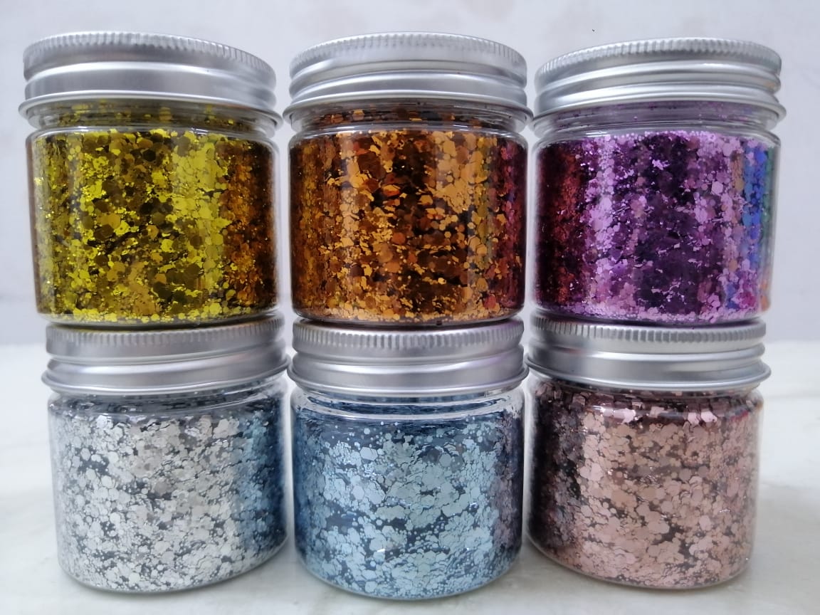 Assorted coarse glitter for decoration and use with epoxy resin, plaster, and candles.