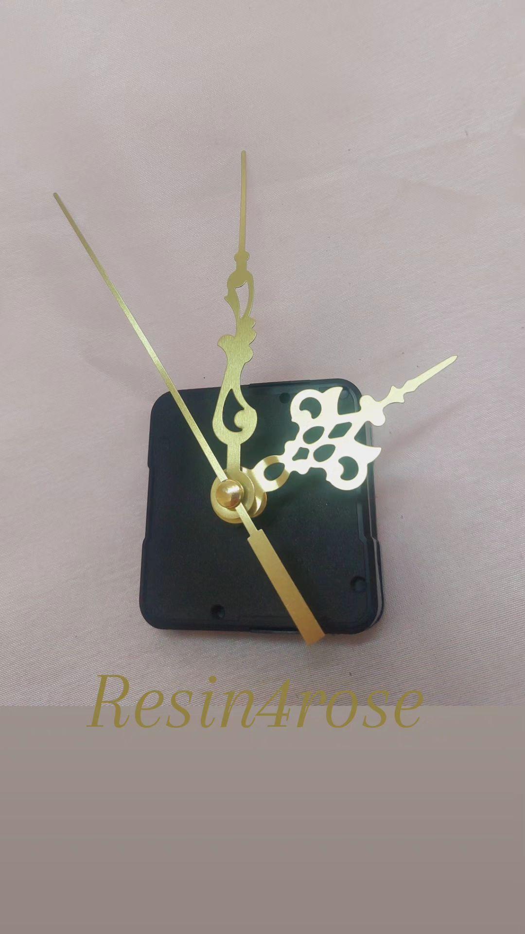 A wall clock mechanism with a set of gold hands, designed in a standard and compact size, is an essential complement to the manufacture of wall clocks of all kinds (resin, wood, acrylic, and geode clocks)