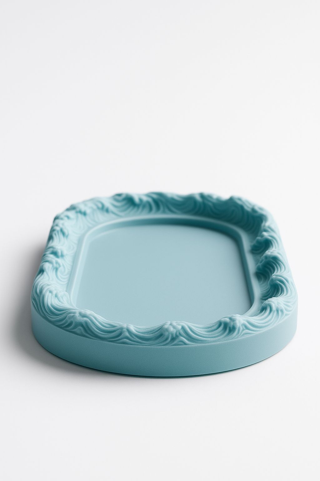 An oval-shaped silicone mold designed for casting decorative-edged trays. Suitable for resin, wax, ceramics, or polymer clay. Length: 12 cm Width: 7 cm