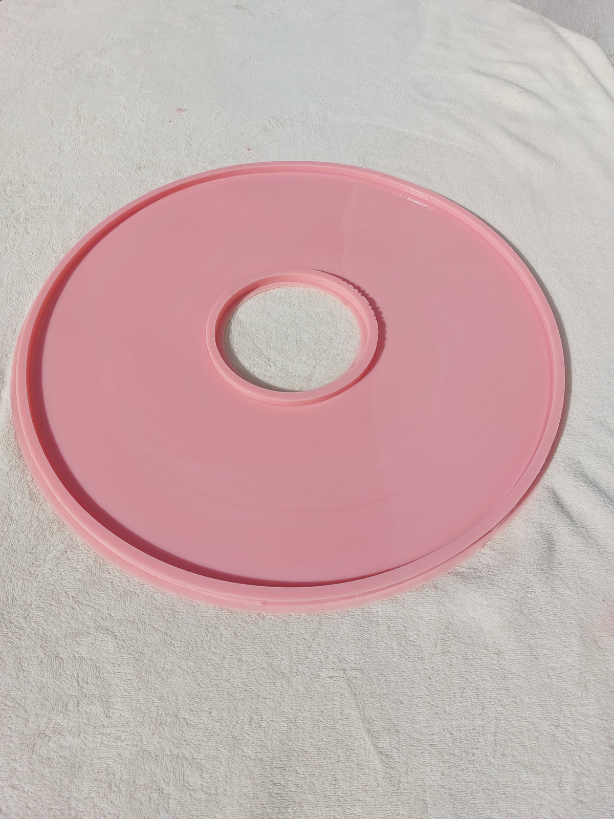 A large, round, hollow silicone mold, ideal for resin, plaster, or pottery enthusiasts to create small decorative pieces and souvenirs.