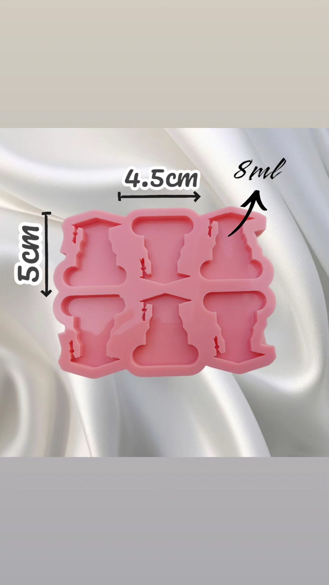 A silicone mold with six cavities, each representing a symbolic graduation cap shape. It can be used for casting resin, wax, or ceramic. Dimensions: 5 x 4.5 cm, Depth: 8 mm