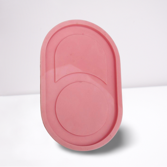 A silicone mold used for resin, wax, or pottery. The mold is characterized by its oval shape with regular curved edges.