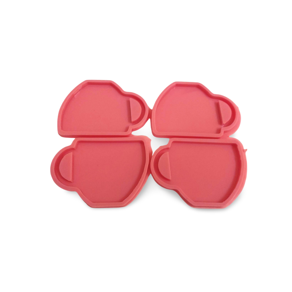 The silicone mold has 4 identical cavities, arranged in two rows. The mold is designed to cast four pieces at once, as it contains 4 interconnected cavities, each cavity taking the shape of a cup or coffee/tea mug.