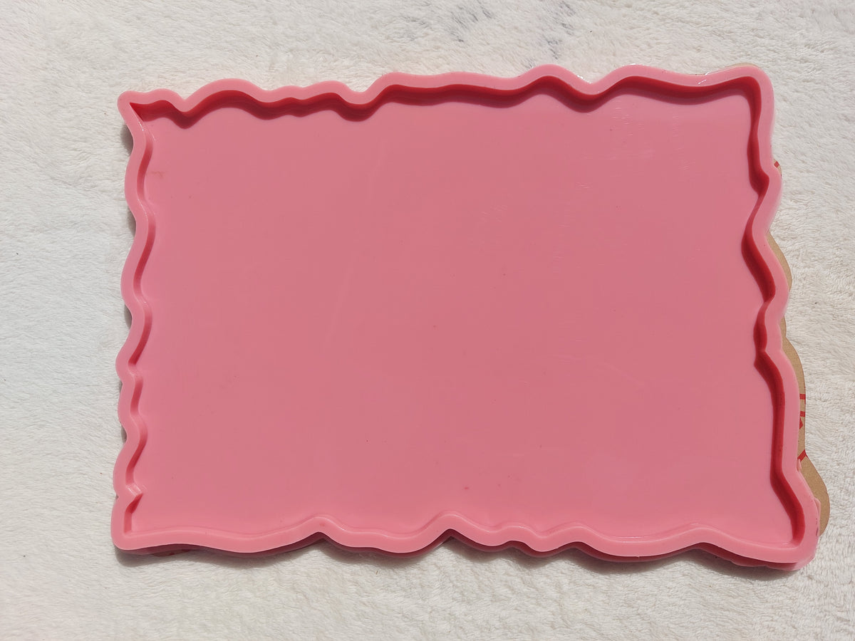 A rectangular silicone mold with irregular, wavy edges, commonly used for making trays and crafts such as casting resin, plaster, or pottery. Dimensions: 30*26 cm, Depth: 8 mm