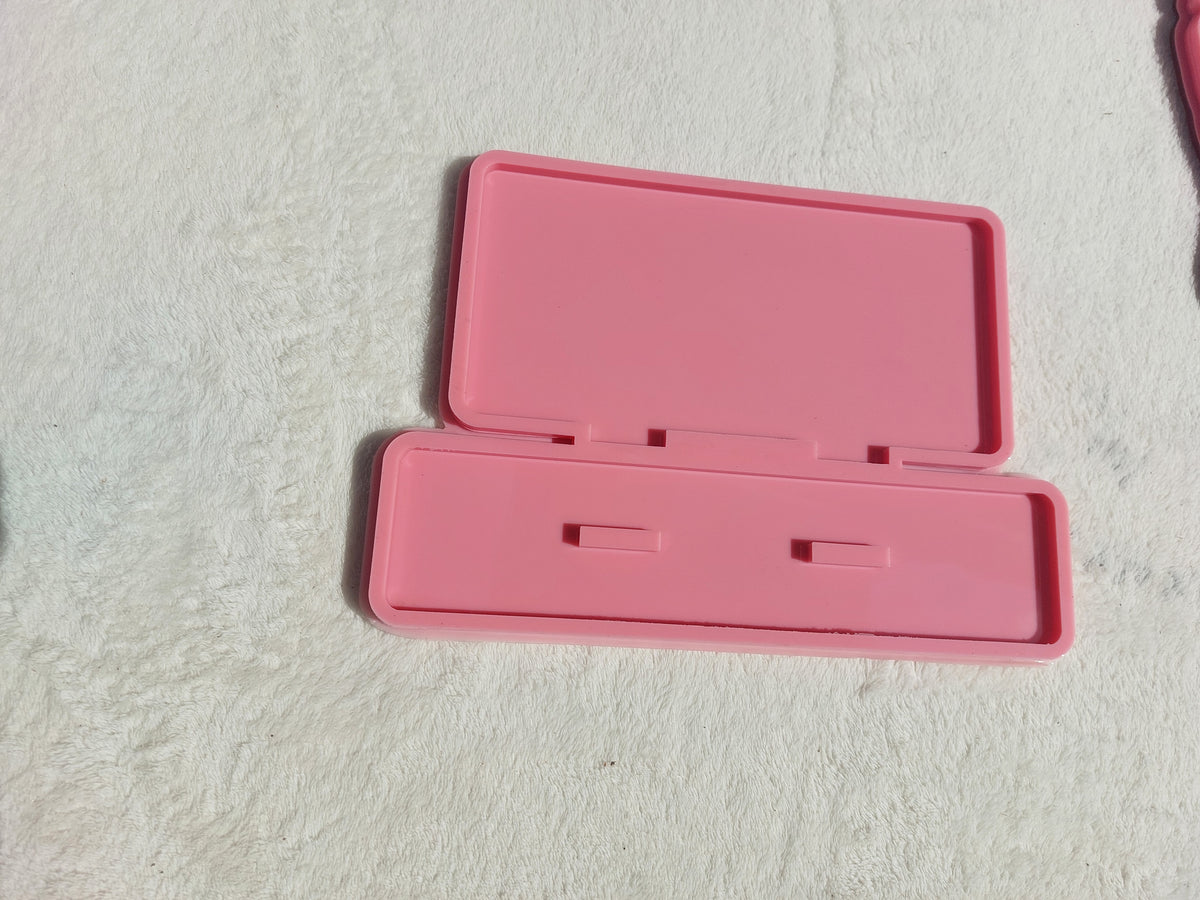 A silicone mold used for making welcome signs, desk plaques, desk calendars, earring organizers, accessories and decorations, nameplates, logos, small picture frames, light bases, or souvenirs. Designed for casting resin, wax, or ceramic