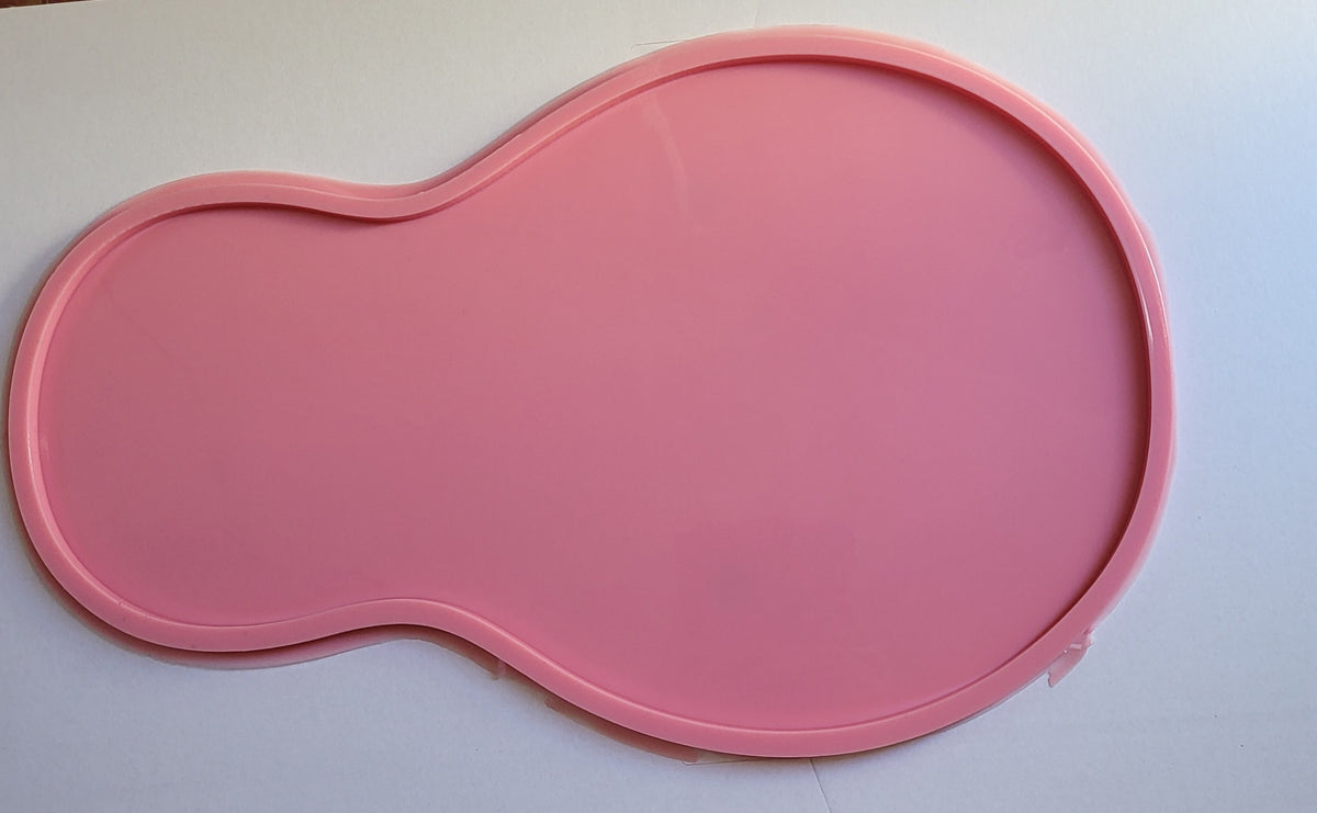 This silicone mold features a curved design consisting of two connected circular parts: a smaller part on the left and a much larger part on the right, resembling a pear or the number 8. The total width is 42mm and the depth is 8mm.