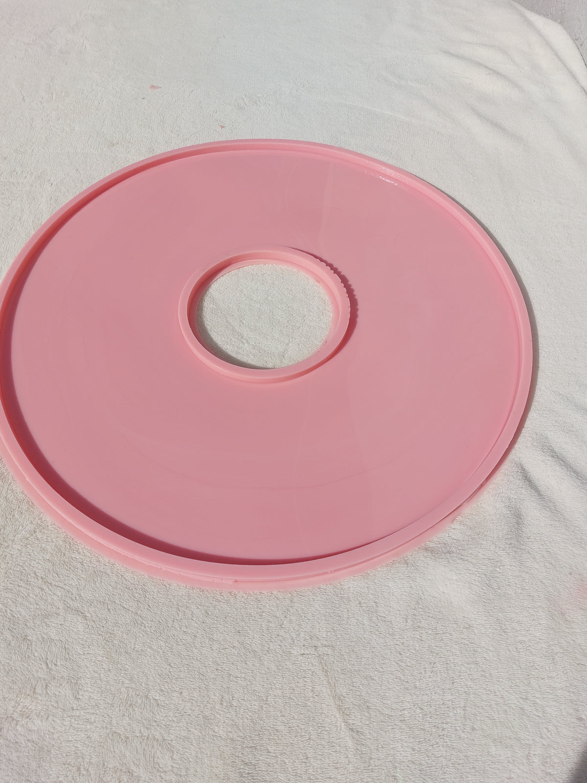 A large, round, hollow silicone mold, ideal for resin, plaster, or pottery enthusiasts to create small decorative pieces and souvenirs.