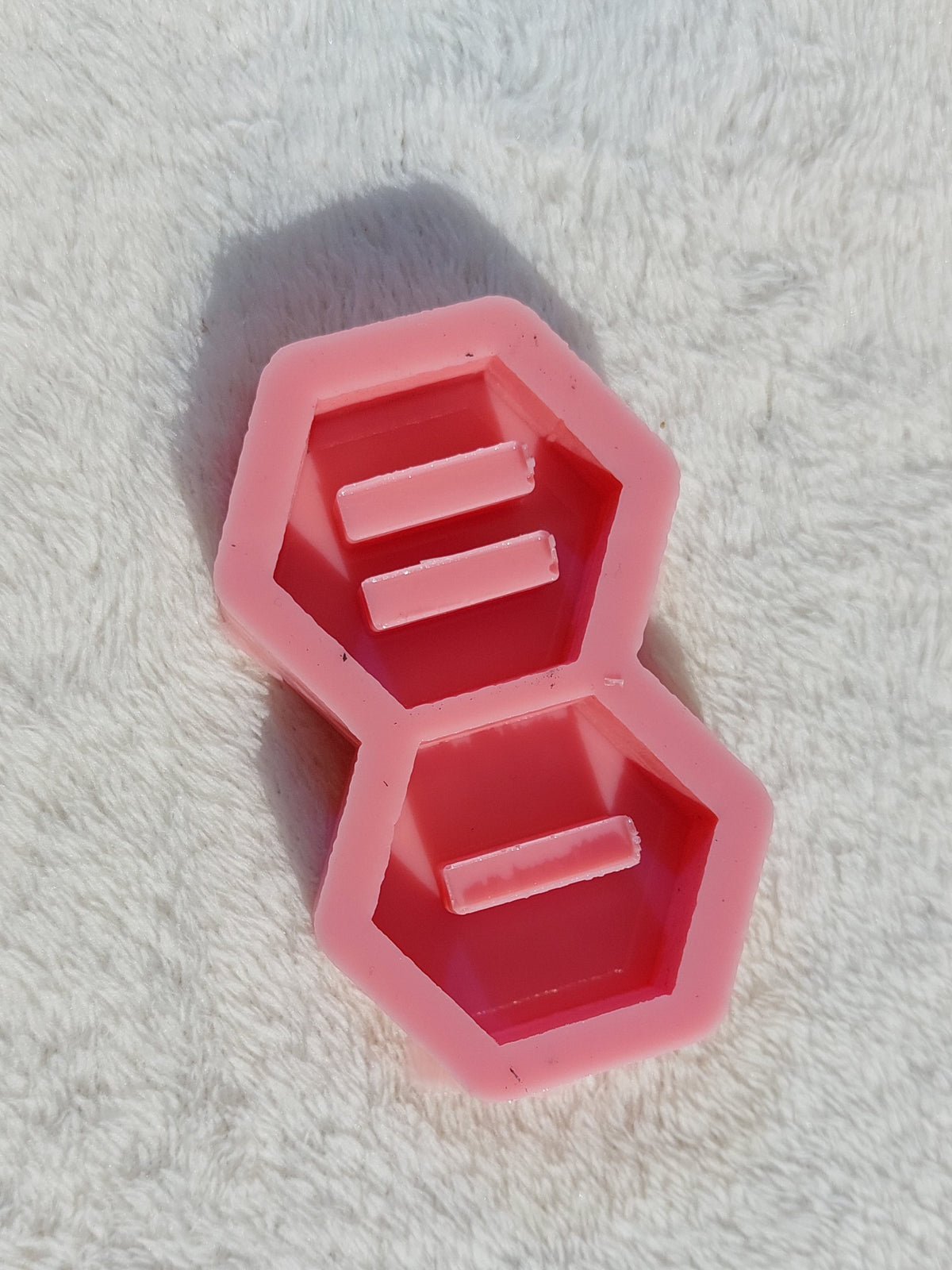 Silicone molds are ring holder stands in various shapes (hexagonal, circular, square, or heart-shaped) and are used for casting resin, wax, pottery, or polymer clay.