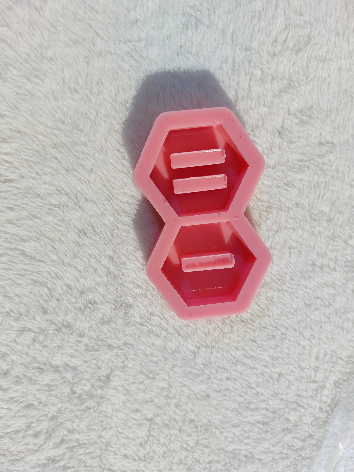 Silicone molds are ring holder stands in various shapes (hexagonal, circular, square, or heart-shaped) and are used for casting resin, wax, pottery, or polymer clay.
