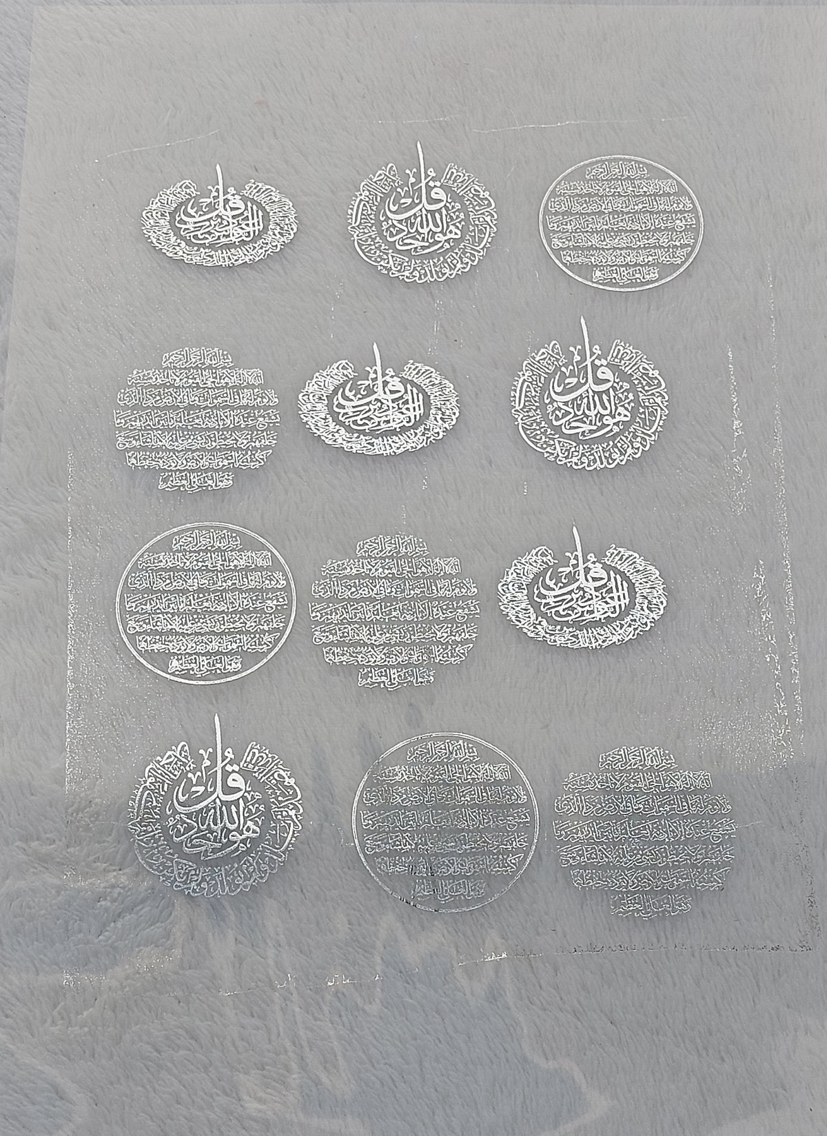 Transparent printed paper or stickers containing Quranic verses and prayers. This type of repeated text is used to be placed inside the included resin molds, or to be glued onto car pendants and medals as handicrafts