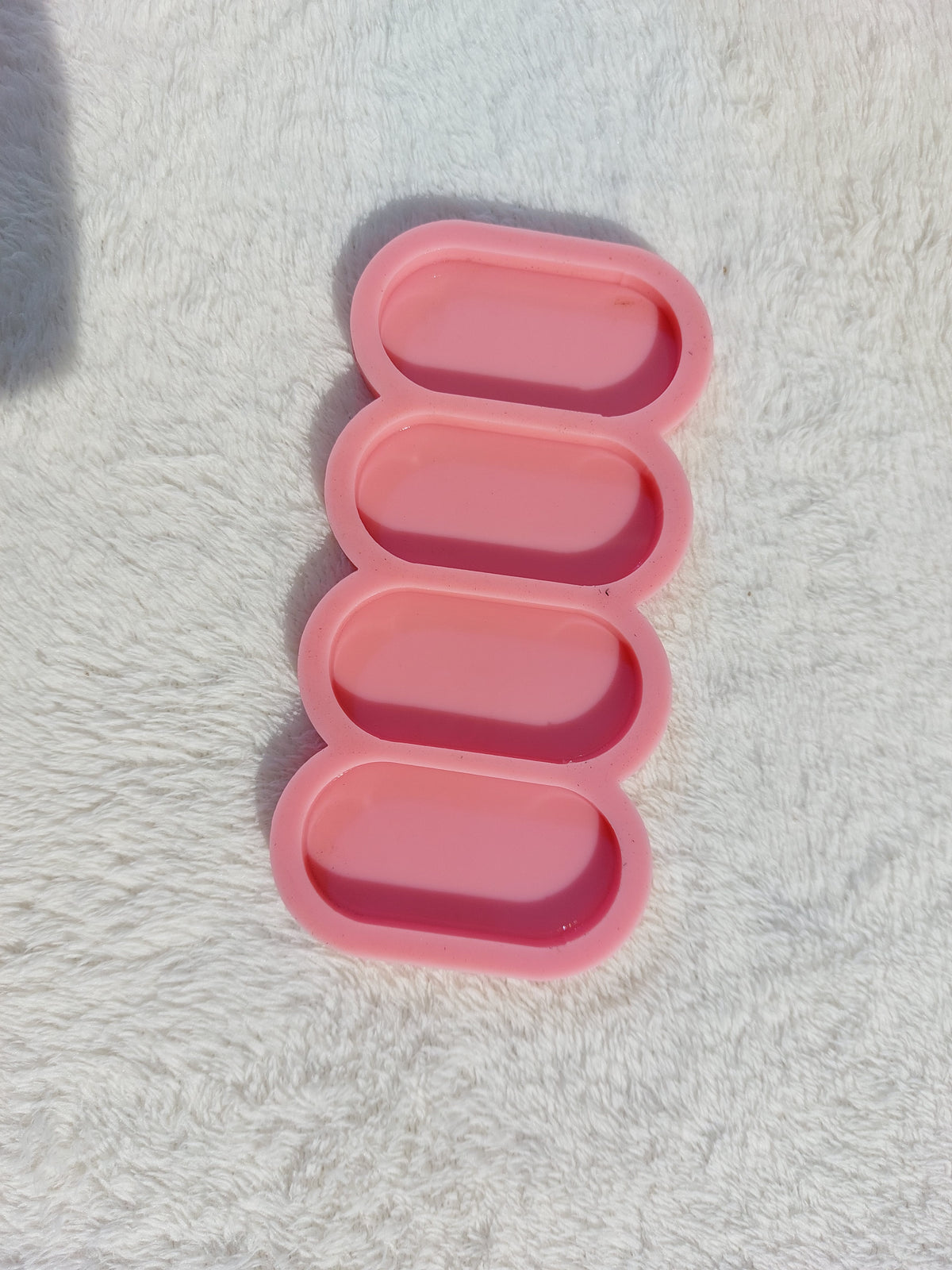 A silicone mold designed for casting resin, wax, or plaster, featuring four oval cavities. It can be used to create bookmarks, earring bases, large pendants, or small decorative pieces size4*6cm