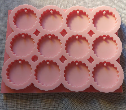 A silicone mold designed for resin, wax, pottery, or handicrafts. The mold is rectangular in shape and contains 12 equal cavities, regularly distributed in 3 rows and 4 columns.