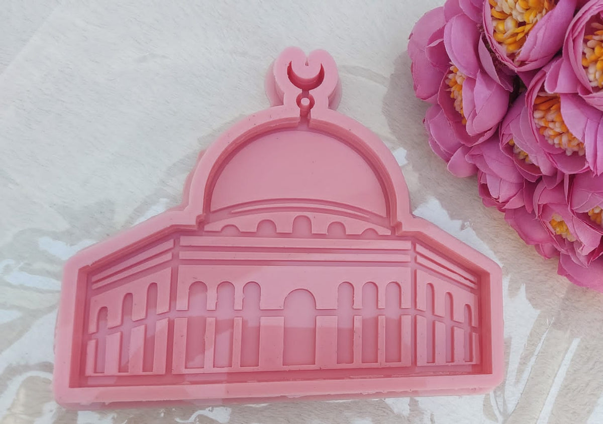A silicone mold designed in the shape of the Dome of the Rock mosque, suitable for casting resin, wax, or ceramic. The design features intricate details of the arches and vertical lines that represent the octagonal facade of the mosque