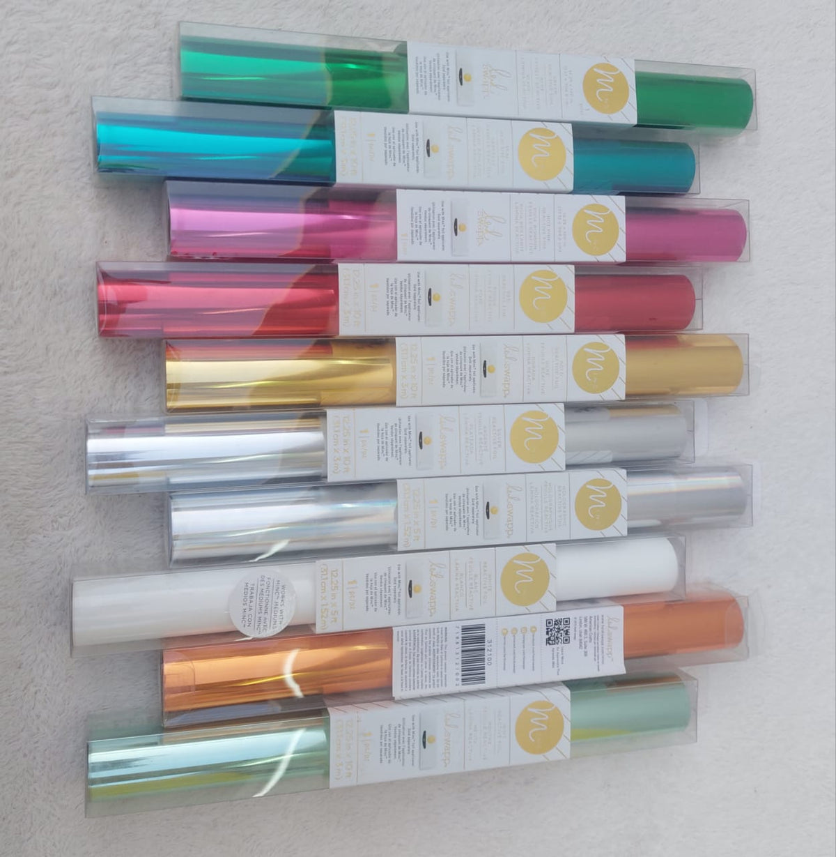 A set of high-quality adhesive vinyl rolls for precisely cutting logos, phrases, and stickers before sticking them onto various surfaces such as glass, acrylic, or incorporating them into resin pieces