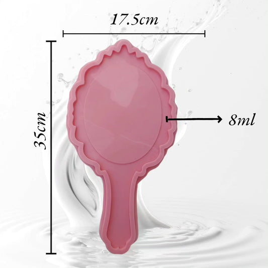 This silicone mold is designed in the shape of a classic hand mirror. The top features a decorative wavy edge and crown-like details at the apex, making it ideal for creating luxurious personalized gifts or unique decorative pieces for a vanity.
