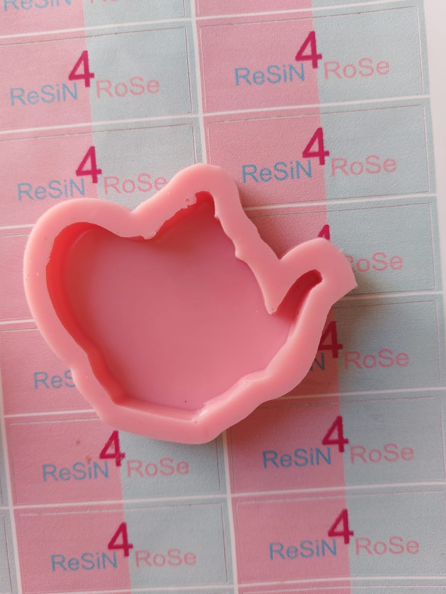A uniquely designed and cute silicone mold perfect for creating small teapot-shaped art pieces, ideal for making coasters, keychains, or kitchen decorations.