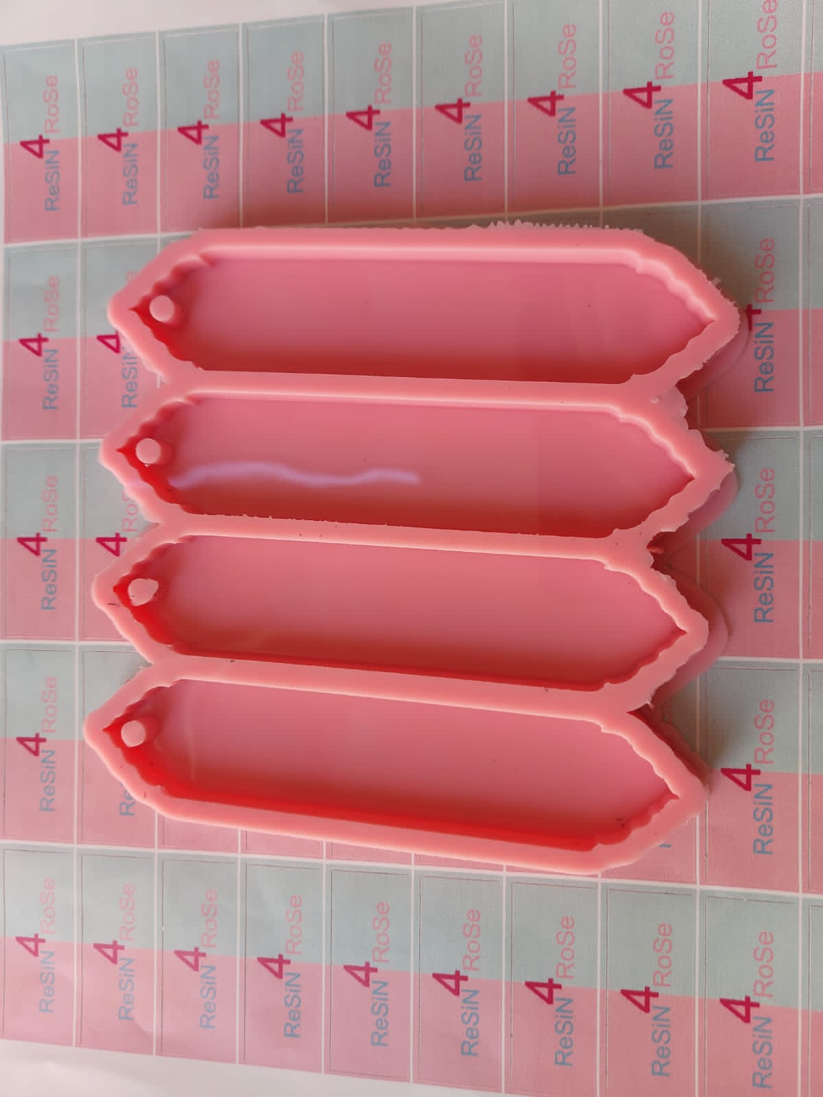 A silicone mold specially designed for making bookmarks using resin, wax, plaster, or ceramic; it contains four cavities in one mold. size 14*3 cm