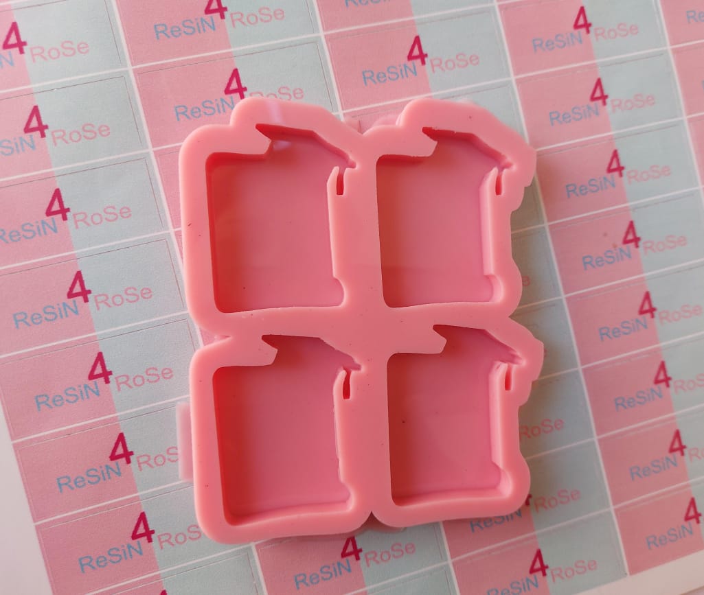 A silicone mold with four interconnected cavities, designed for crafts such as casting resin, polymer clay, or wax. Shaped like a graduation cap, measuring 5 x 3.5 cm.