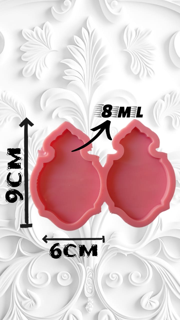 A silicone mold with two connected cavities, each designed in the shape of an Islamic motif, mihrab, or flat lantern, used for making resin favors for religious occasions or holidays, or for making medals or car charms size 9*6 cm