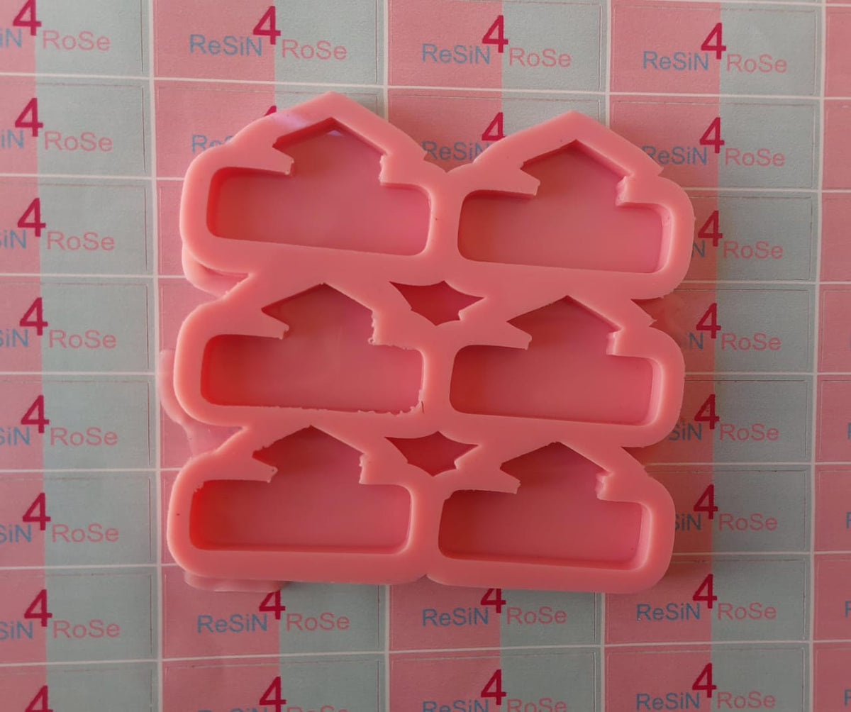 A silicone mold with 6 interconnected cavities, each shaped like a small house or cottage, designed for crafts with a unique geometric design. Dimensions: 3 x 5 cm