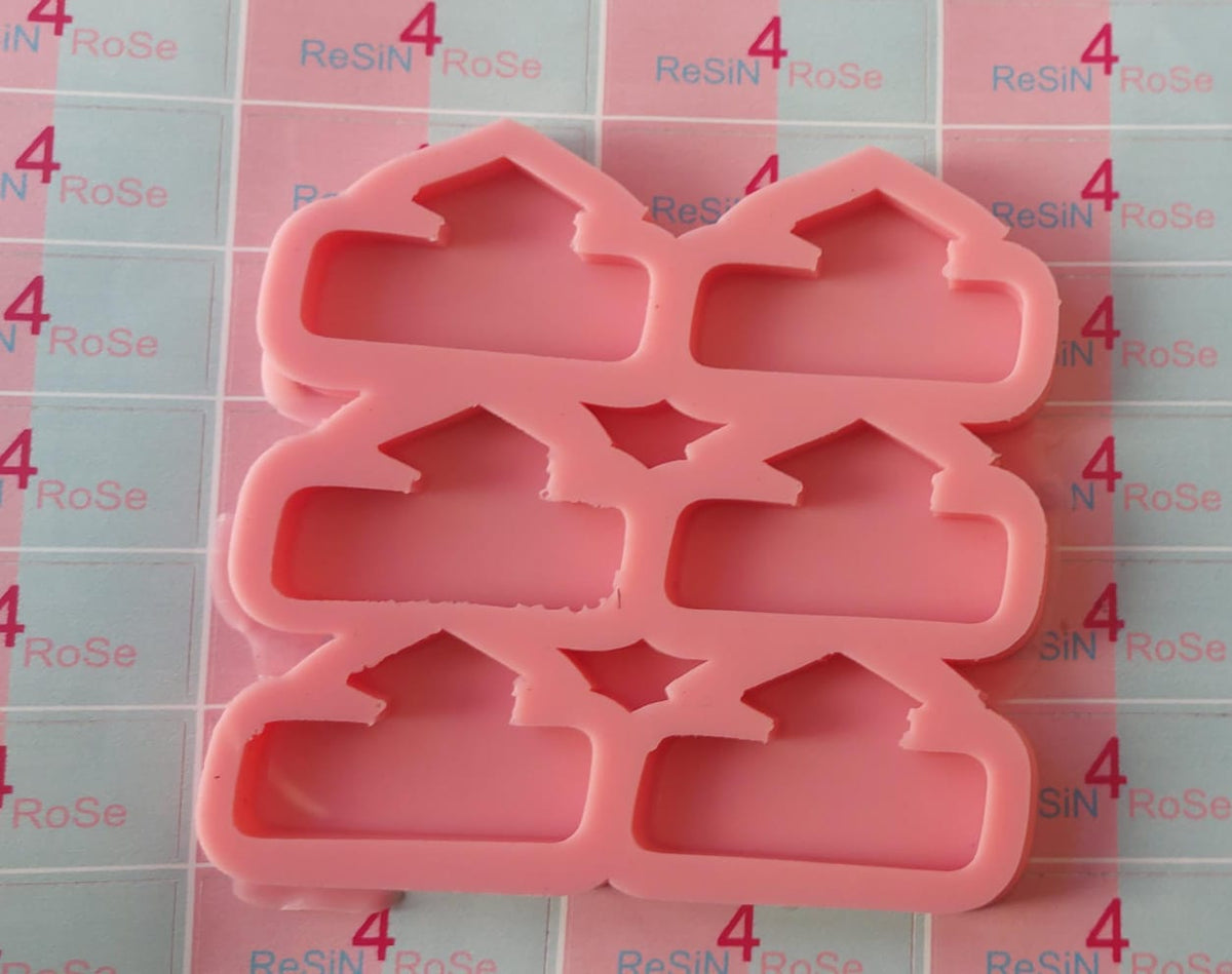 A silicone mold with 6 interconnected cavities, each shaped like a small house or cottage, designed for crafts with a unique geometric design. Dimensions: 3 x 5 cm