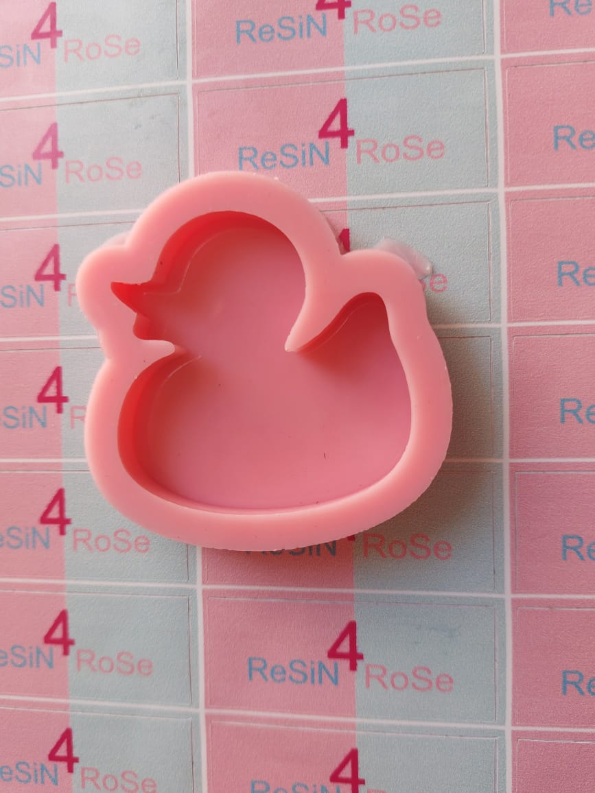 A silicone mold used for casting resin, wax, plaster, or pottery. Designed in the shape of a duck, this mold is great for making small, elegant coasters, pendants, or decorative pieces. Size: 5 x 5 cm