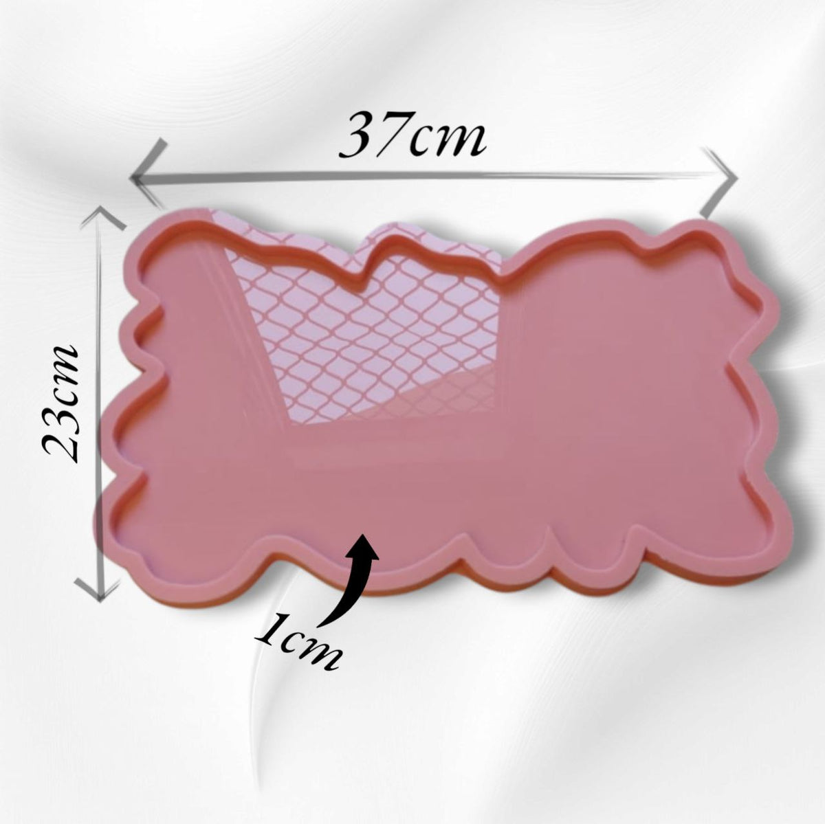A rectangular silicone mold with irregular, wavy edges, commonly used for making trays and crafts such as casting resin, plaster, or pottery. Dimensions: 37 x 32 cm, Depth: 1 cm