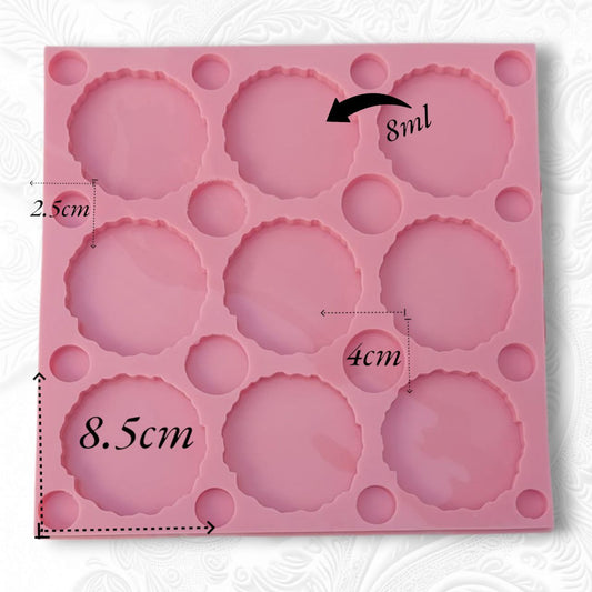 The silicone mold features a large square shape containing several cavities of different sizes.