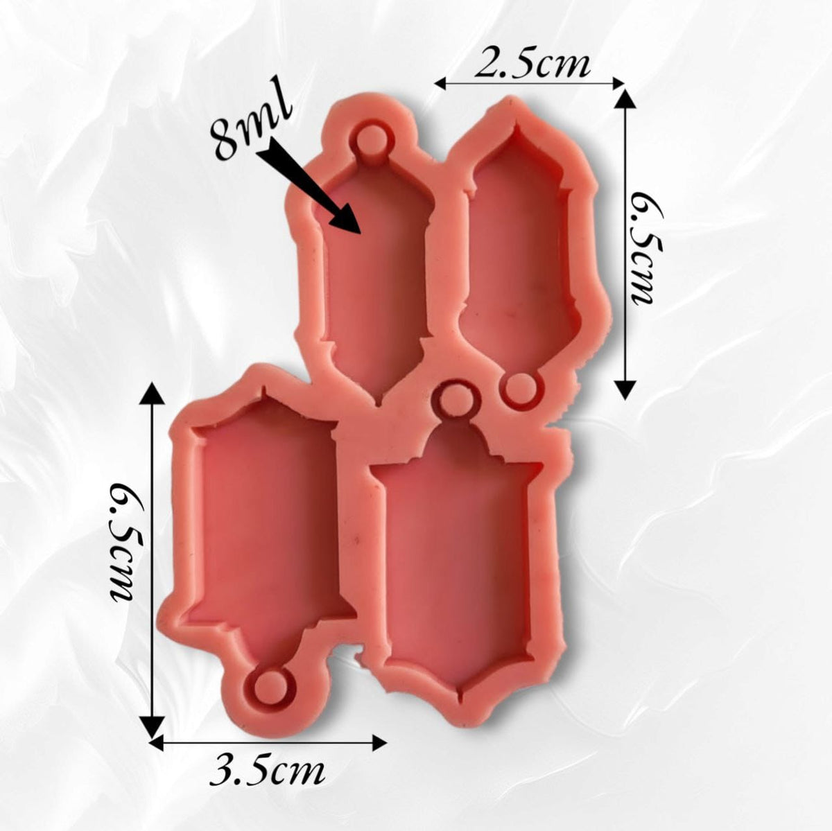 A silicone mold with four different shaped cavities designed to create decorative elongated shapes, often used as pendants, earrings, or necklaces. It can be used for casting resin, wax, pottery, or plaster. The mold comes in two different sizes