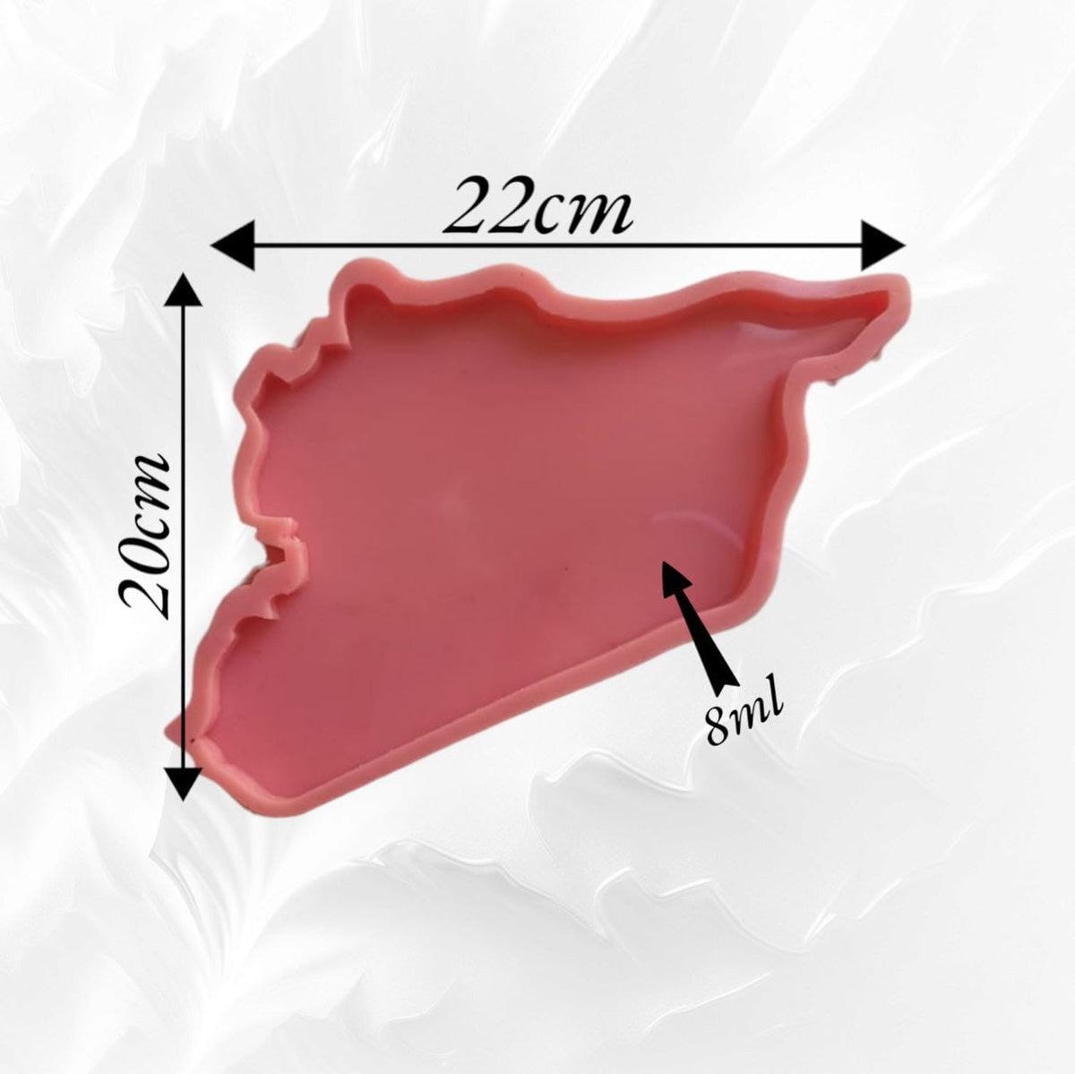A silicone mold designed in the shape of a map of Syria with detailed geographical borders. It can be used to create relatively large art pieces such as wall hangings, serving trays, or desk decorations that express Syrian identity. Dimensions: 20 x 21 cm