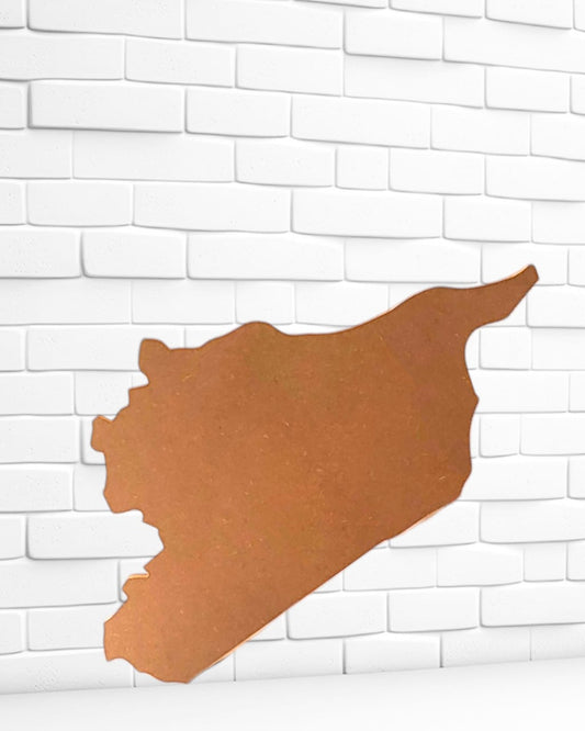 A unique piece of wood, meticulously crafted in the shape of a map of Syria, used to make clocks, exquisite artistic sculptures, souvenirs, or wall hangings for national occasions and celebrations