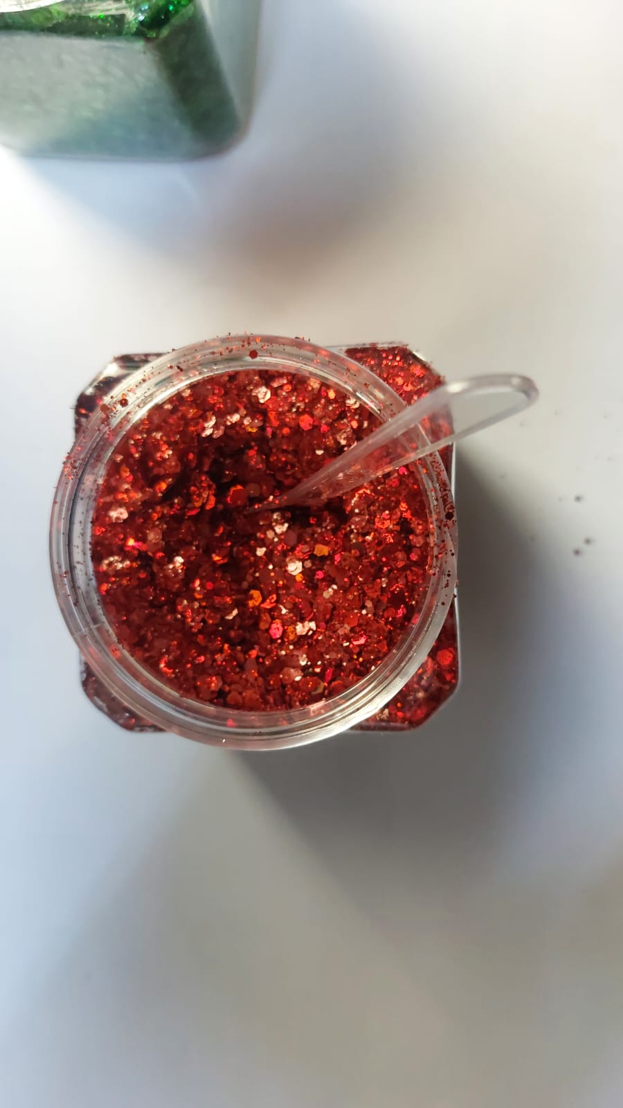 Assorted coarse glitter for decoration and use with epoxy resin, plaster, and candles.
