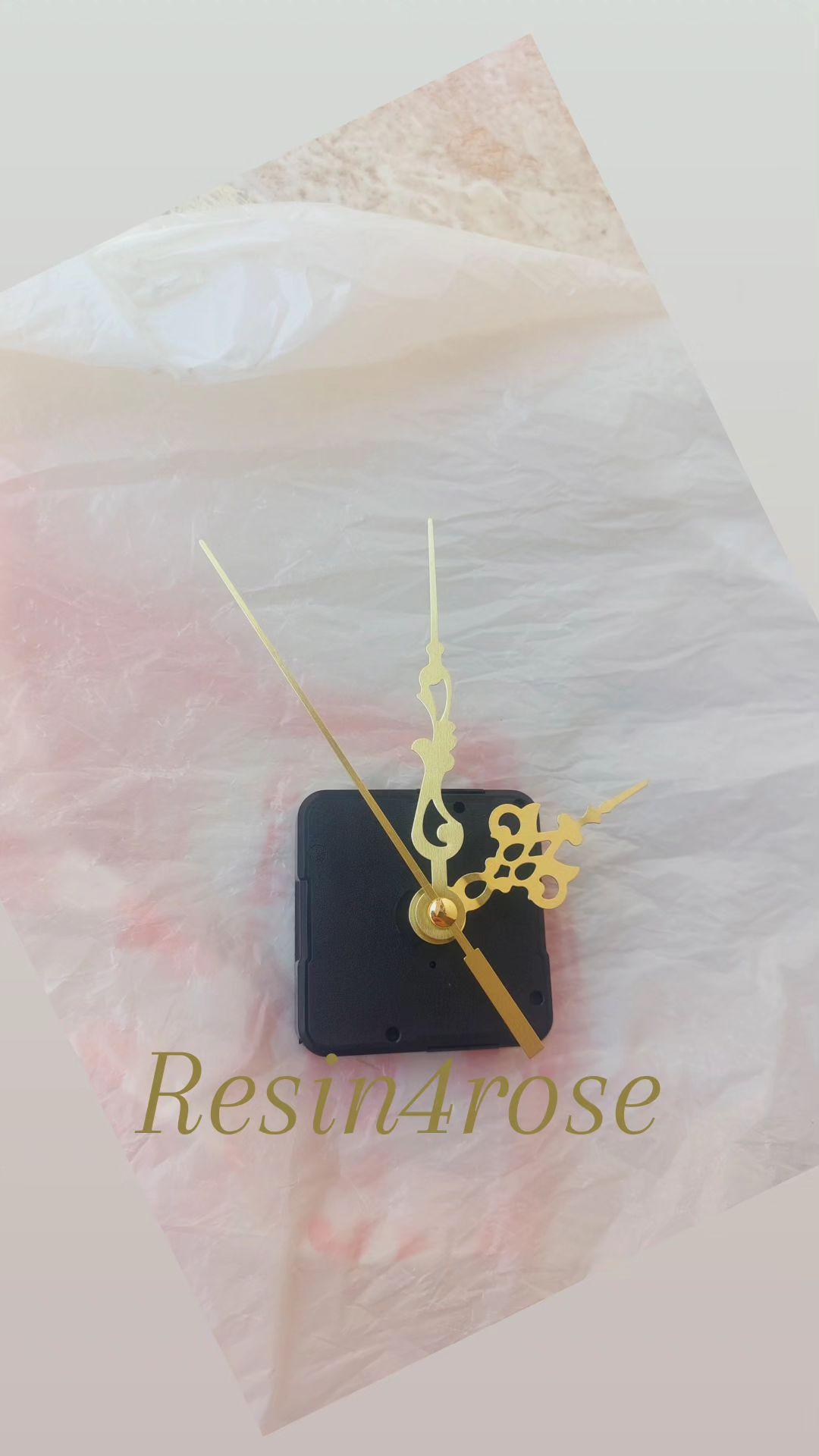 A wall clock mechanism with a set of gold hands, designed in a standard and compact size, is an essential complement to the manufacture of wall clocks of all kinds (resin, wood, acrylic, and geode clocks)