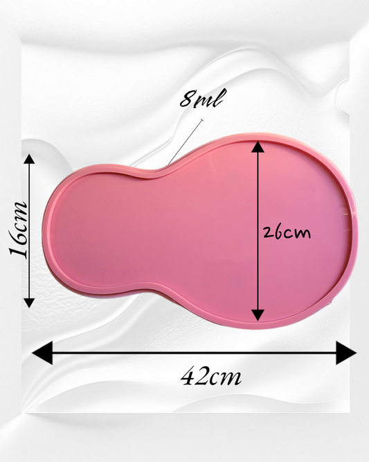 This silicone mold features a curved design consisting of two connected circular parts: a smaller part on the left and a much larger part on the right, resembling a pear or the number 8. The total width is 42mm and the depth is 8mm.