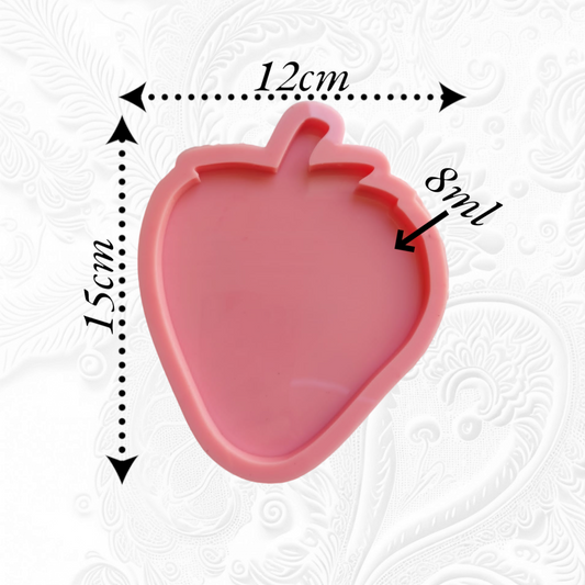 A silicone mold with one large, flat cavity, designed in the shape of a cute and cheerful strawberry. Dimensions: 15*12 cm, Depth: 8 mm
