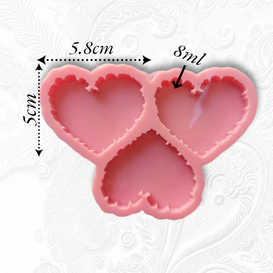 A silicone mold with three interconnected hearts featuring jagged, serrated edges. Used for casting resin, plaster, or wax. Size: 5*6 cm