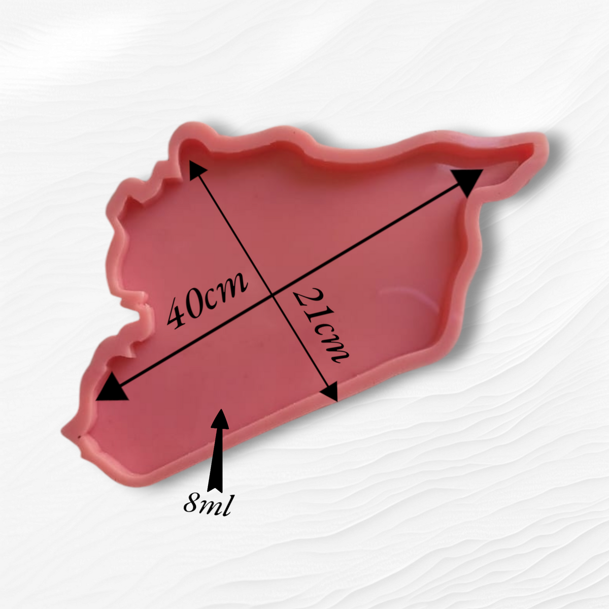 A silicone mold designed in the shape of a map of Syria with detailed geographical borders. It can be used to create relatively large art pieces such as wall hangings, serving trays, or desk decorations that express Syrian identity. Dimensions: 40 x 21 cm