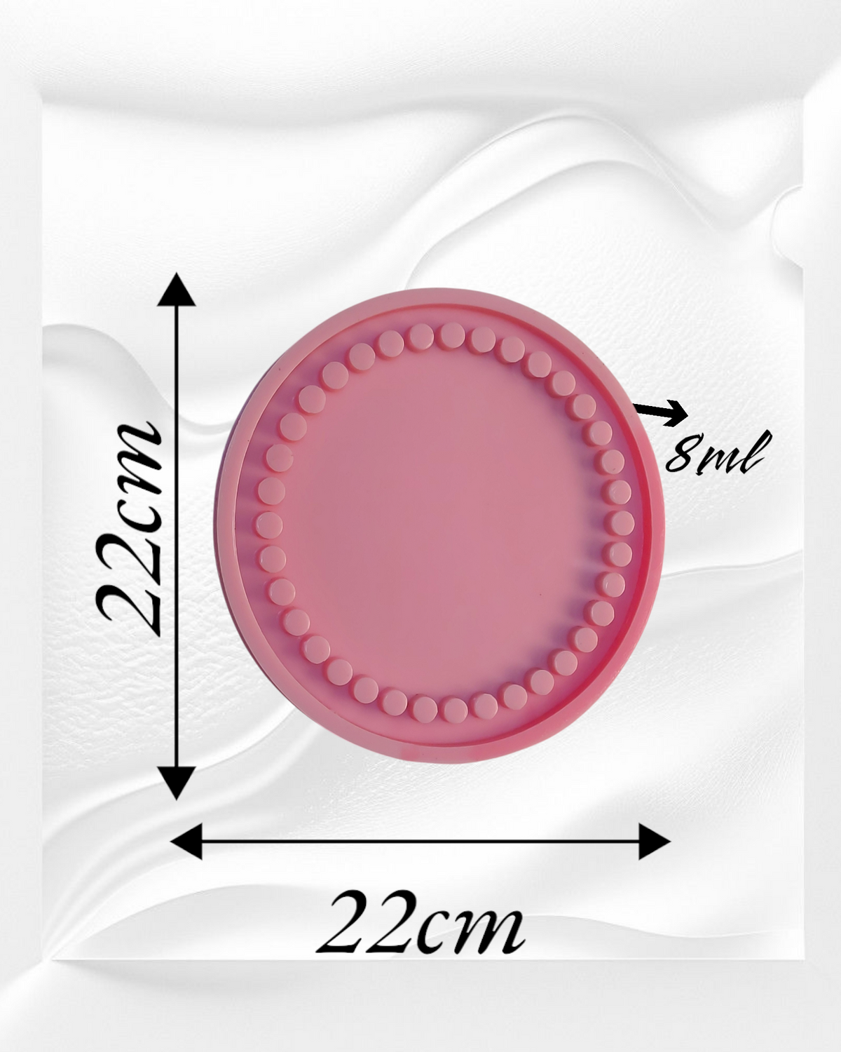 A round silicone mold designed for casting resin or plaster or pottery to create coasters or small decorative plates. It features small raised circles surrounding the flat center of the mold. Diameter: 22 cm. Depth: 8 mm.