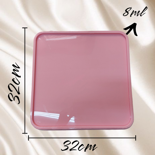 This square silicone mold features smooth, rounded corners and is designed for casting resin or various craft materials to create trays or flat art pieces. Dimensions: 32 cm x 32 cm, Depth: 8 mm