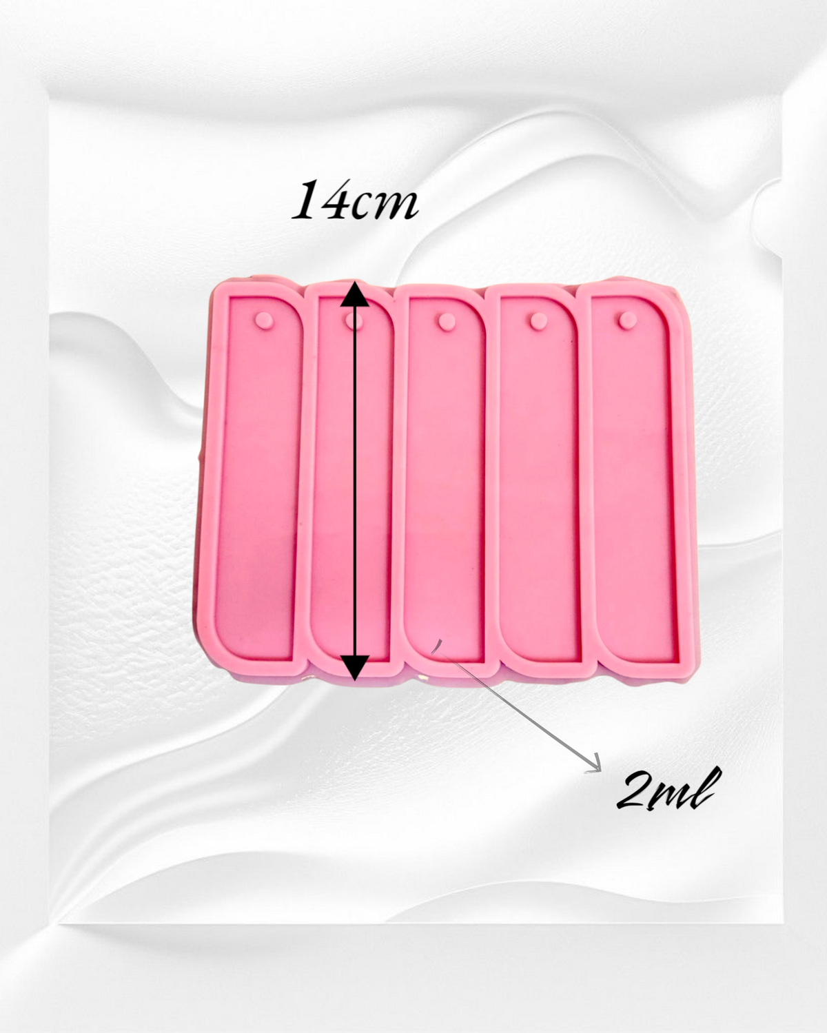 A silicone mold with four identical, elongated rectangular cavities designed to create decorative elongated shapes, ideal for use as bookmarks or decorative pieces. Cavity length: 14 cm
