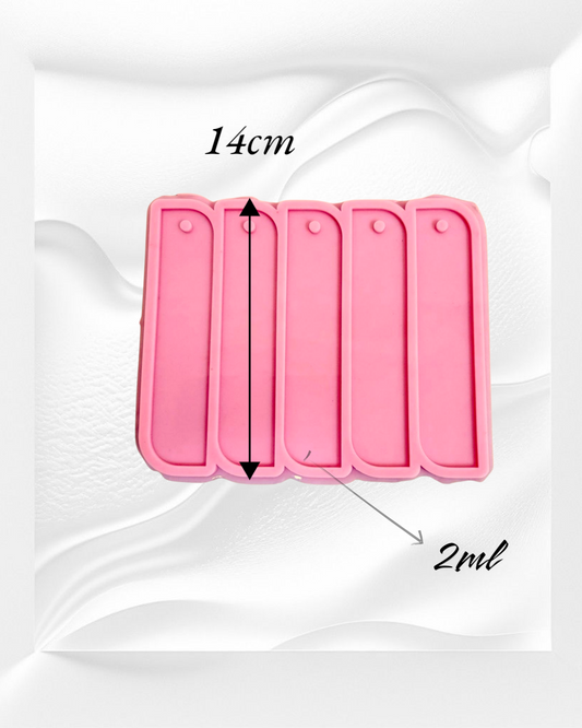 A silicone mold with four identical, elongated rectangular cavities designed to create decorative elongated shapes, ideal for use as bookmarks or decorative pieces. Cavity length: 14 cm