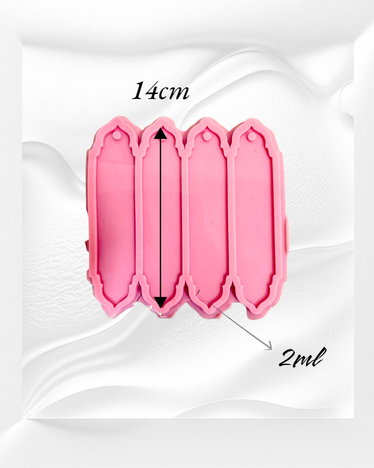A silicone mold with four identical, elongated rectangular cavities designed to create decorative elongated shapes, ideal for use as bookmarks or decorative pieces. Cavity length: 14 cm