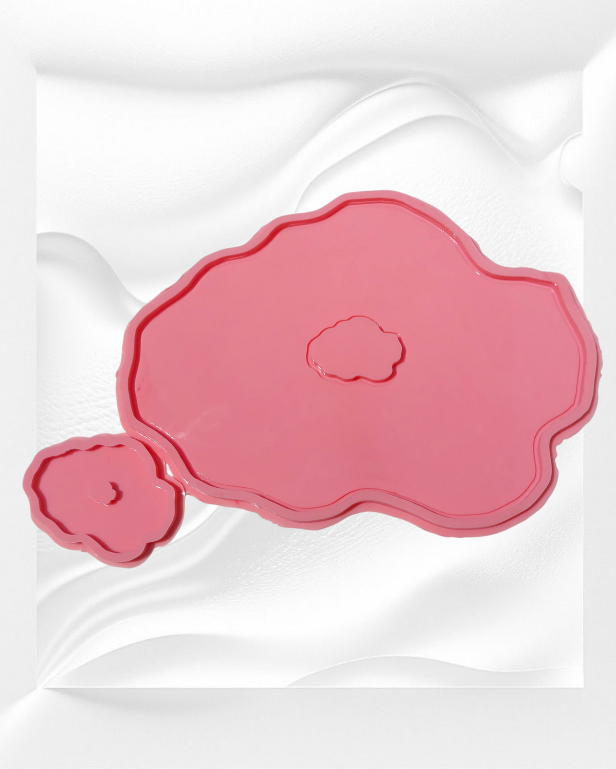 This silicone mold features an irregular, organic design that mimics the wavy edges of natural gemstones or stone slabs. It has a wide, flat main cavity with a small, irregularly shaped protrusion in the center.