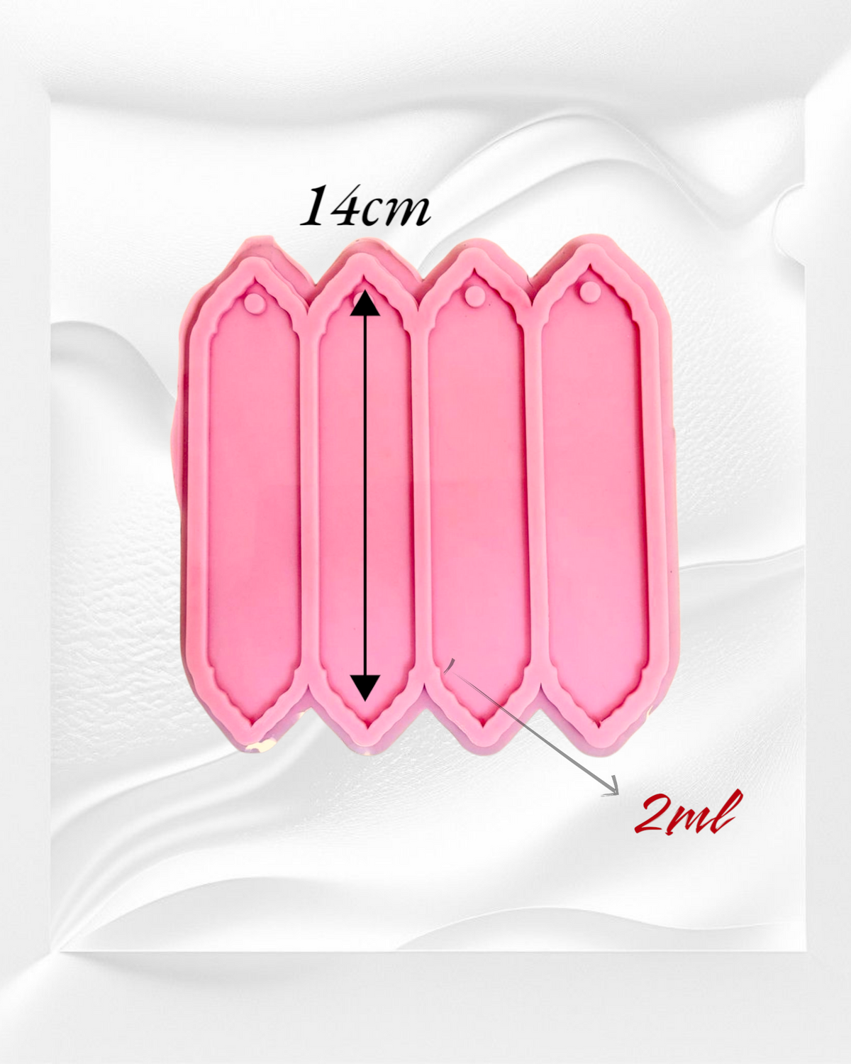 A silicone mold with four identical, elongated rectangular cavities designed to create decorative elongated shapes, ideal for use as bookmarks or decorative pieces. Cavity length: 14 cm
