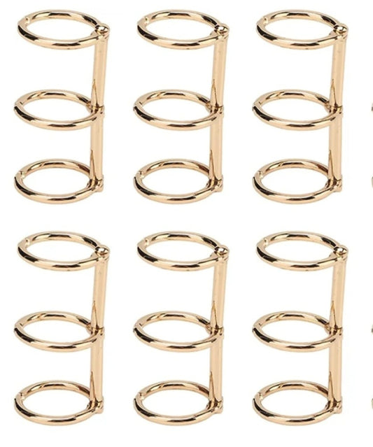 A set of three integrated metal binding rings used for collecting papers and notes, and is very popular in crafts for making notebooks, diaries, or custom photo albums using resin or acrylic covers